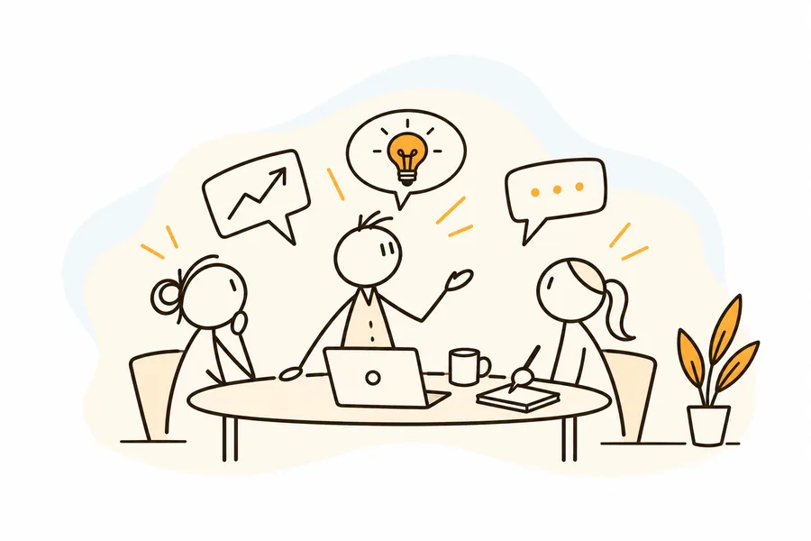 Three colleagues sharing ideas around a table